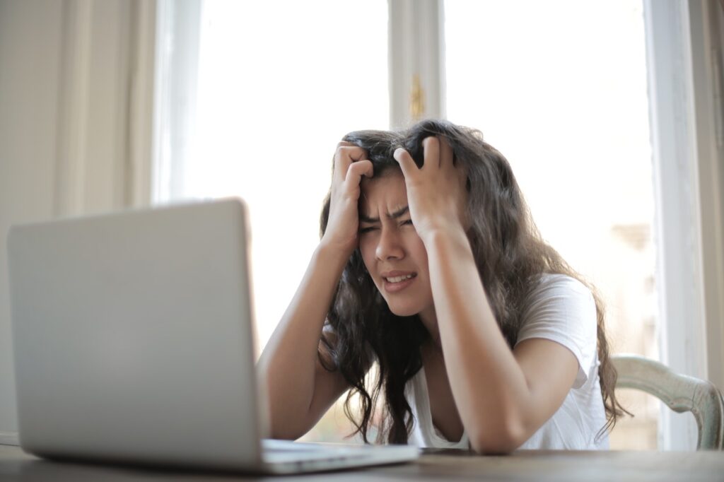 Woman In White Shirt Showing Frustration 3807738 1024x682